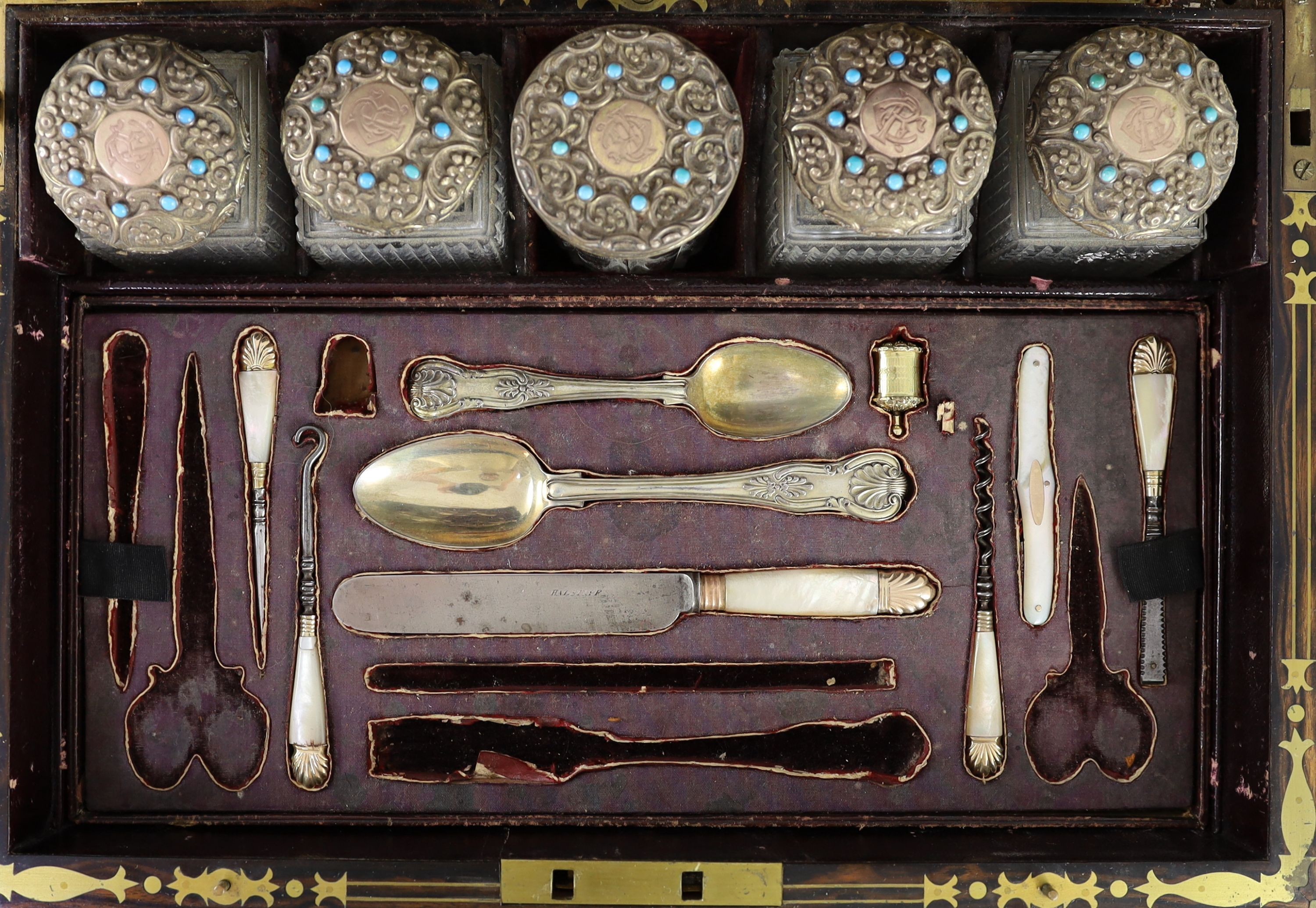 A good Victorian brass mounted and brass monogrammed coromandel travelling toilet set, containing fifteen silver gilt and turquoise bead mounted glass jars and bottles, by Hallstaff & Hannaford